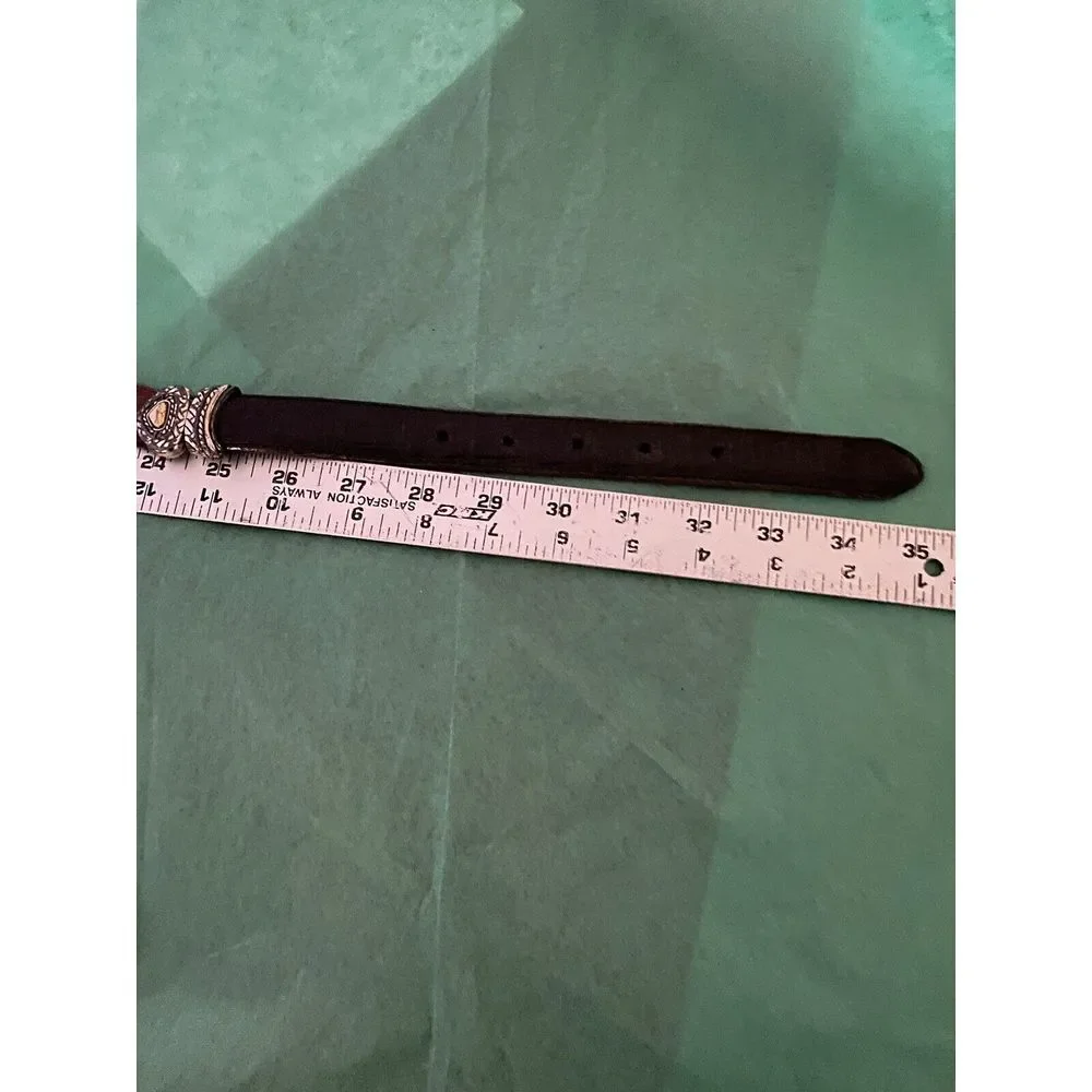 Ladies leather reversible belt black and brown with embellishments. Size med/30.